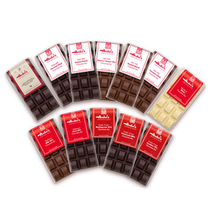 Assorted chocolate bars with red and white packaging on a white background
