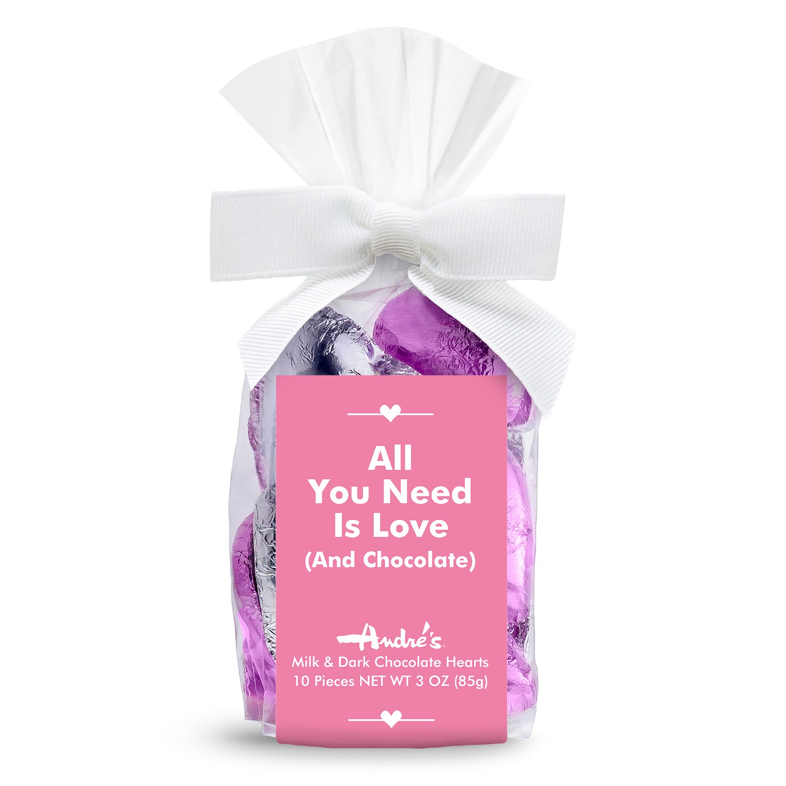 silver and lavender foil covered chocolate hearts in a clear bag with a white bow and pink product label with "All You Need is Love (and chocolate)" above the logo