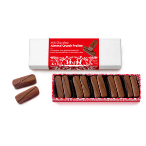 open red box base with 10 chocolate candies visible, milk chocolate covered, each with small dark chocolate stripe accent. 2 loose candies beside and closed white lid box above with red and white Swiss print packaging.
