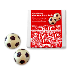 Almond Pralé Chocolate Soccer Balls in a decorative box on a white background