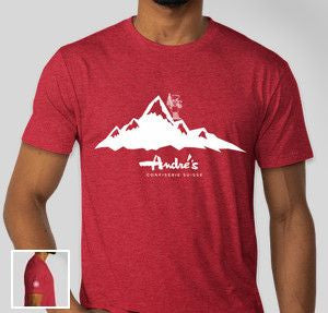 Red t-shirt with mountain logo and 'Andrie's' text worn by a person on a white background