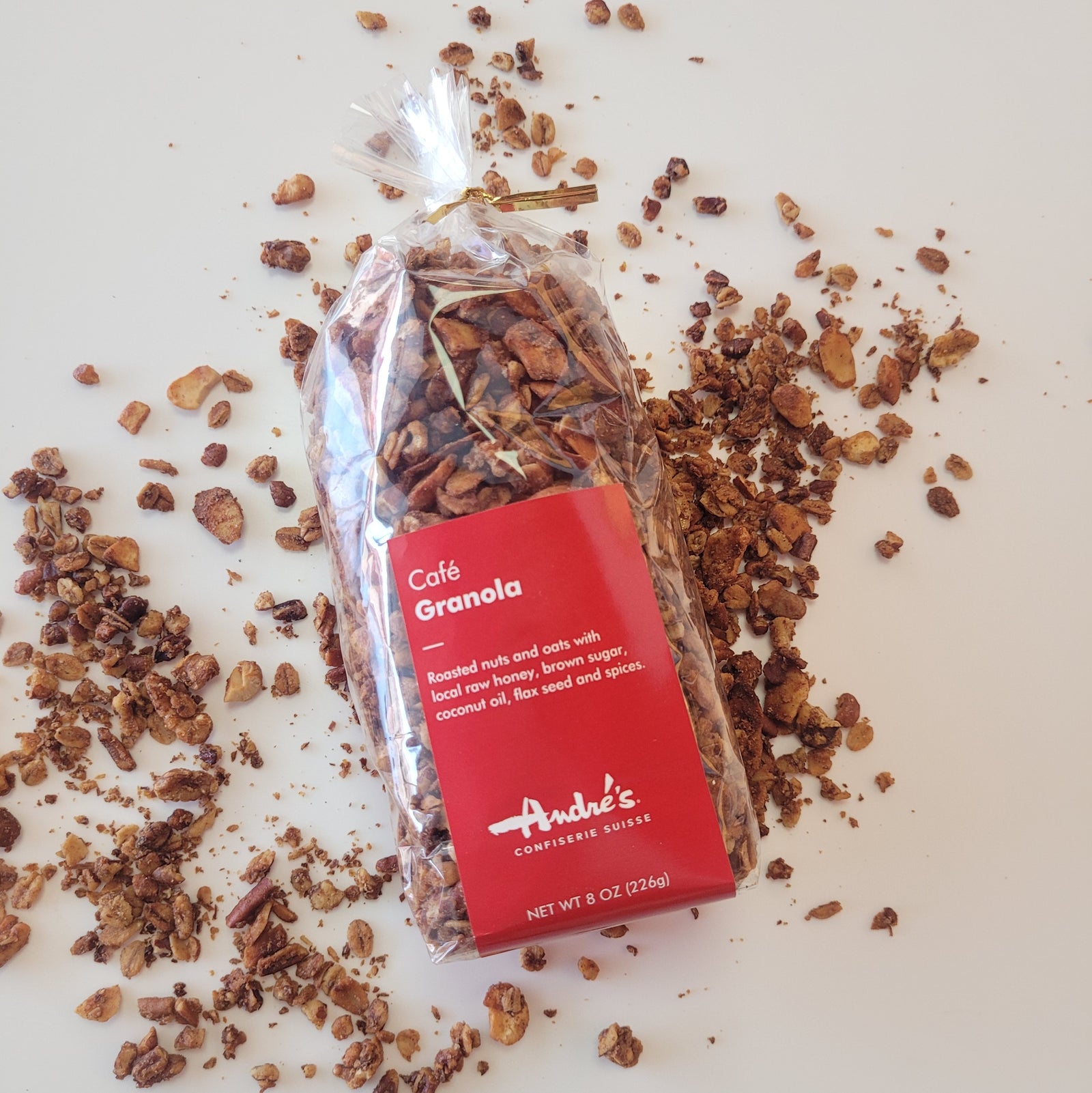 Clear bag filled with golden brown toasted granola with red product label