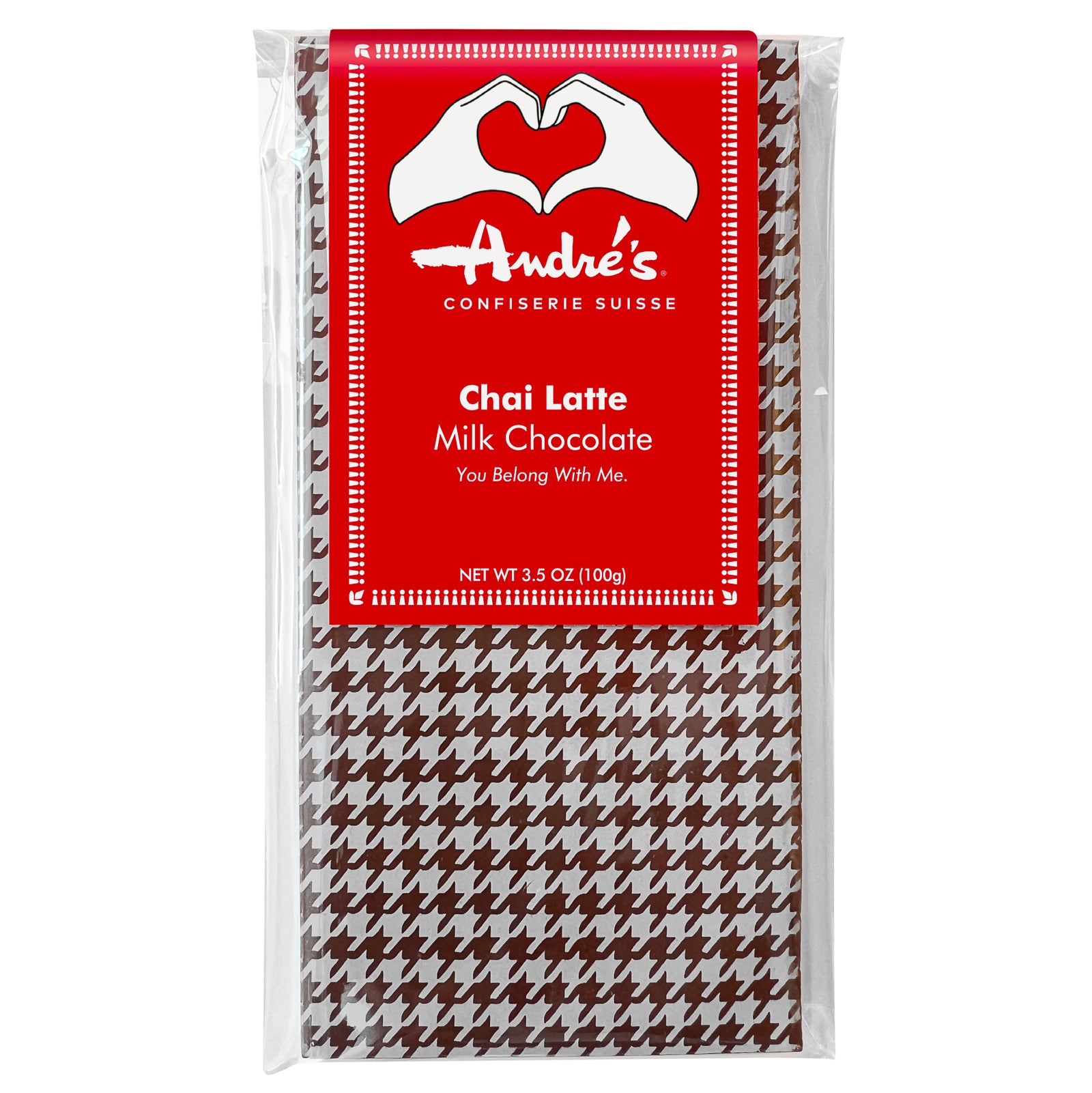 Houndstooth print chocolate bar with red Chai Latte Milk Chocolate label featuring two hands forming a heart with tagline "You Belong With Me"