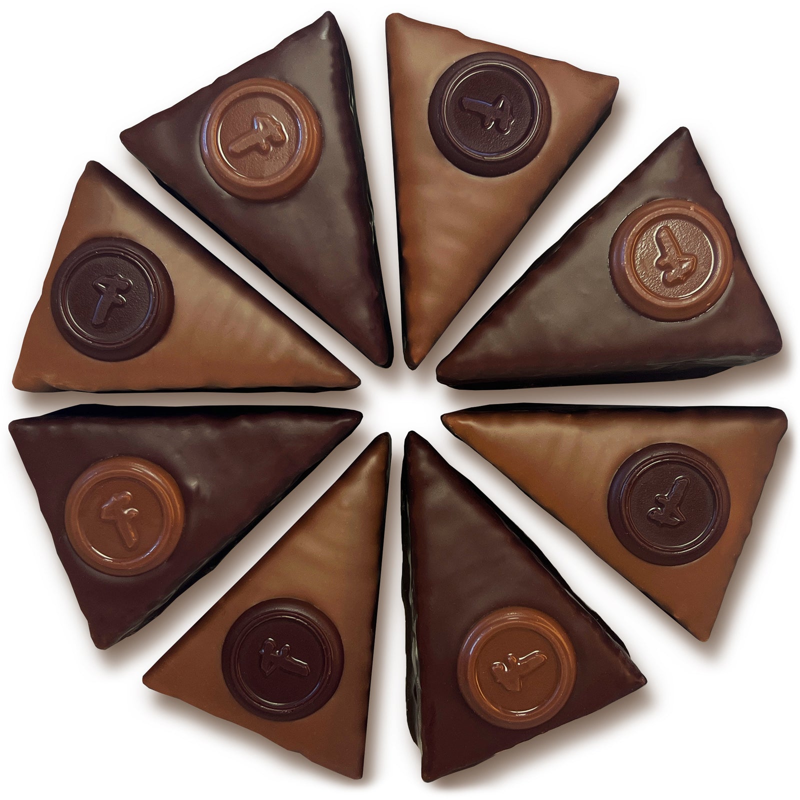 overhead view of 8 Engadiner slices in a circle: triangles of chocolate covered caramel, nuts and cookie crust covered either milk or dark with opposite flavor "A" medallion
