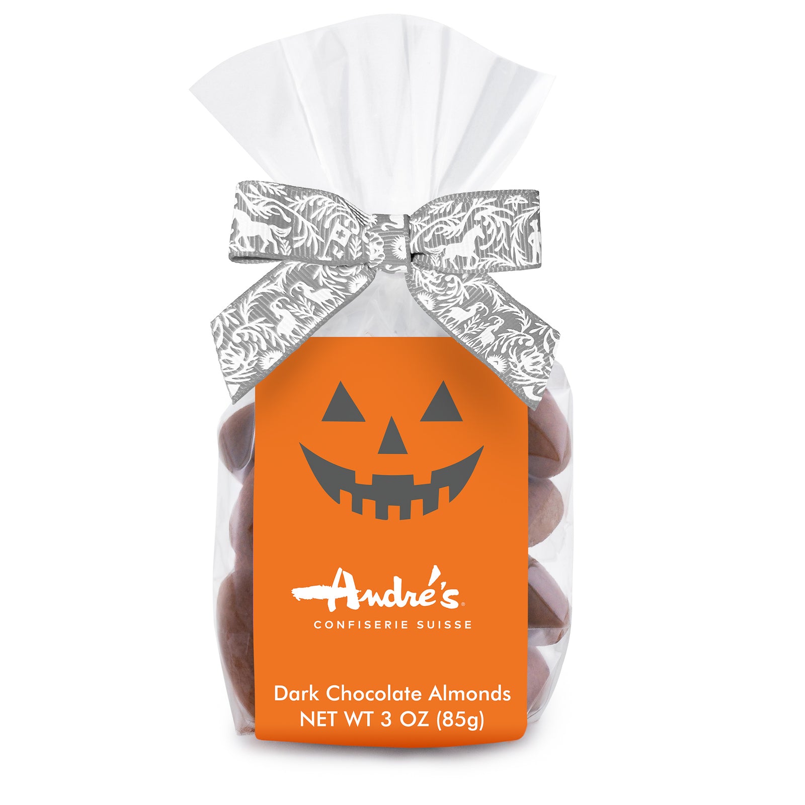 Clear bag of dark chocolate and cocoa powder covered almonds with a grey and white Swiss print bow and orange product label that features a Jack o'Lantern smile above the Andre's logo