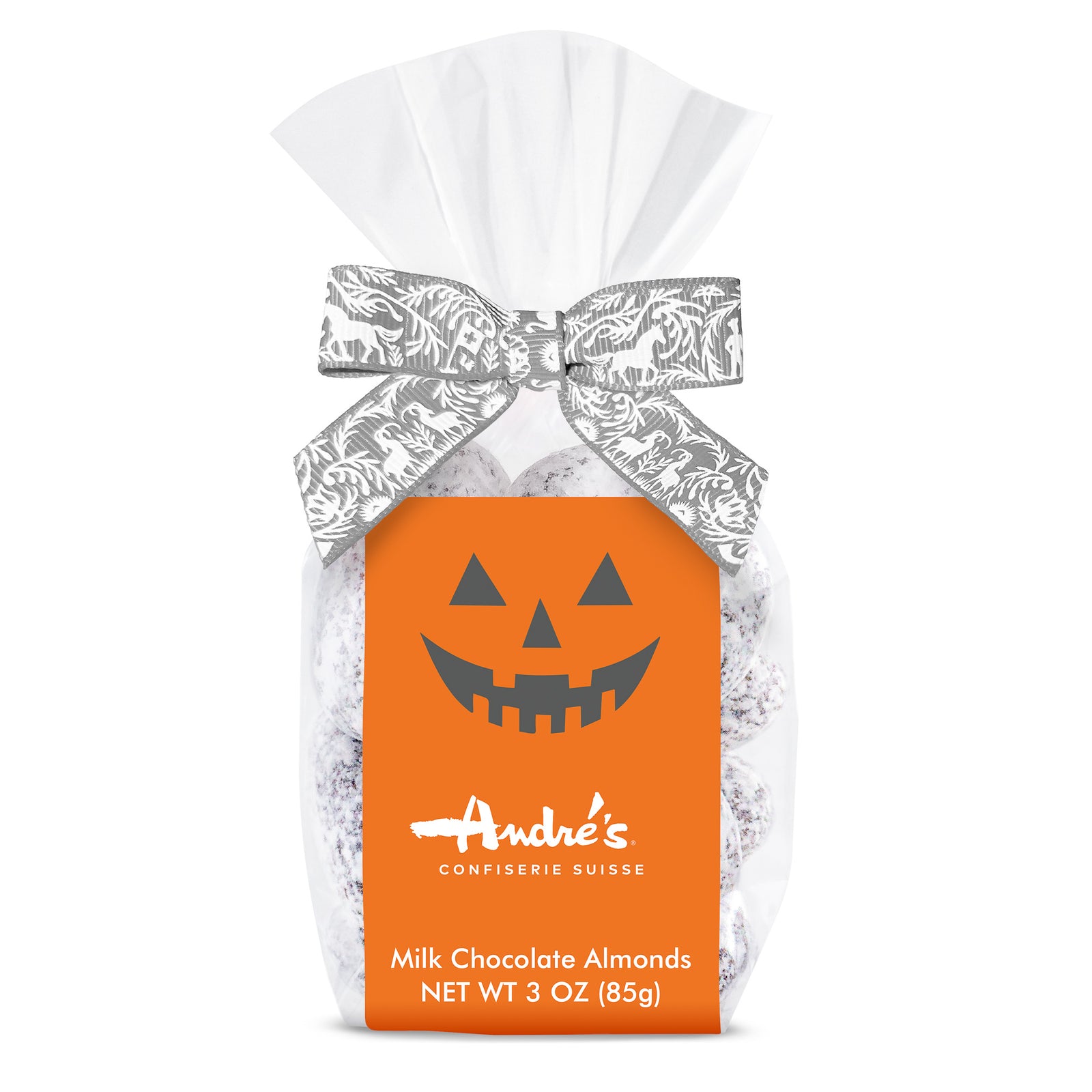 Clear bag of dark chocolate and cocoa powder covered almonds with a grey and white Swiss print bow and orange product label that features a Jack o'Lantern smile above the Andre's logo