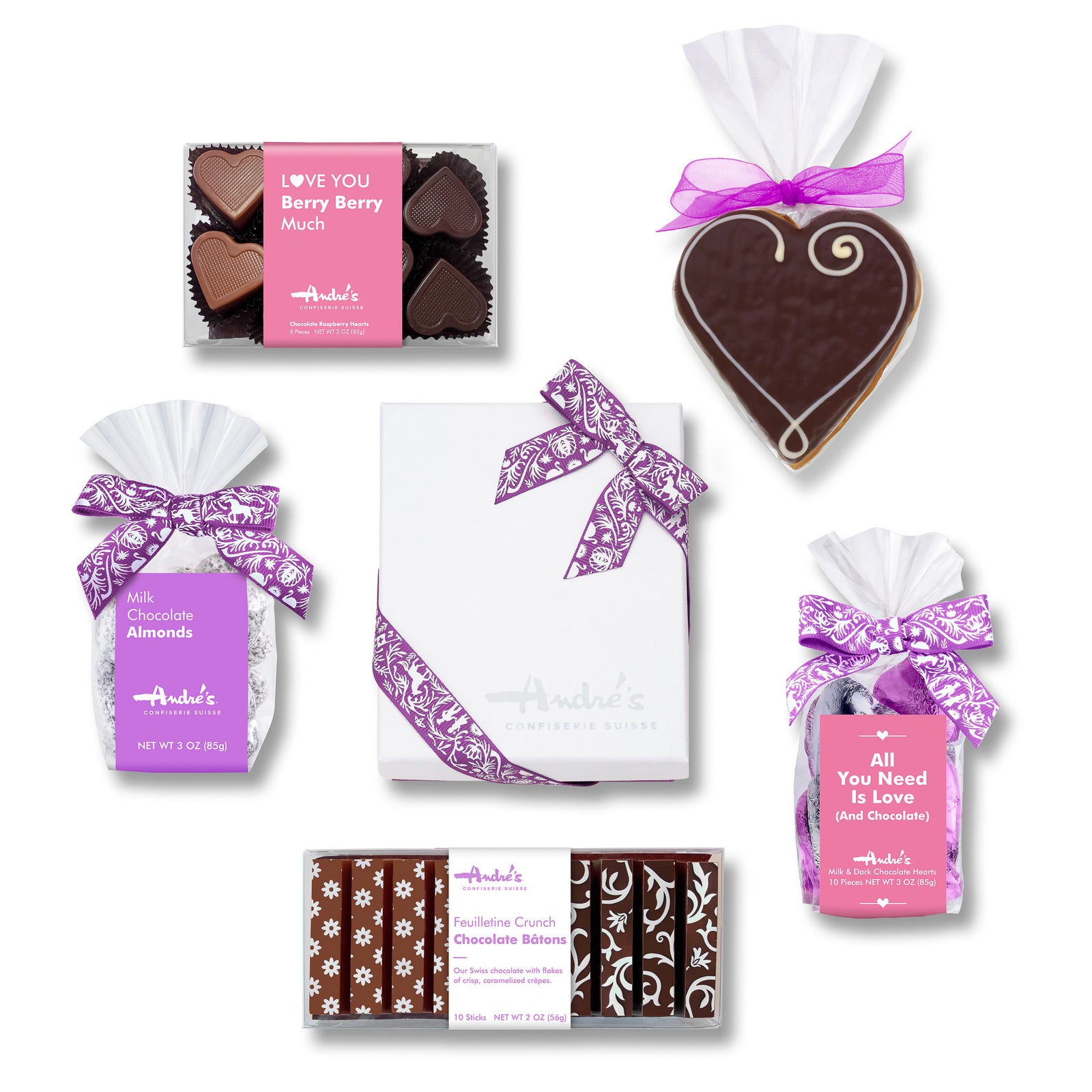 Overhead view of contents of Mother's Day Gift Box, all with purple and pink bows and labels on a white table