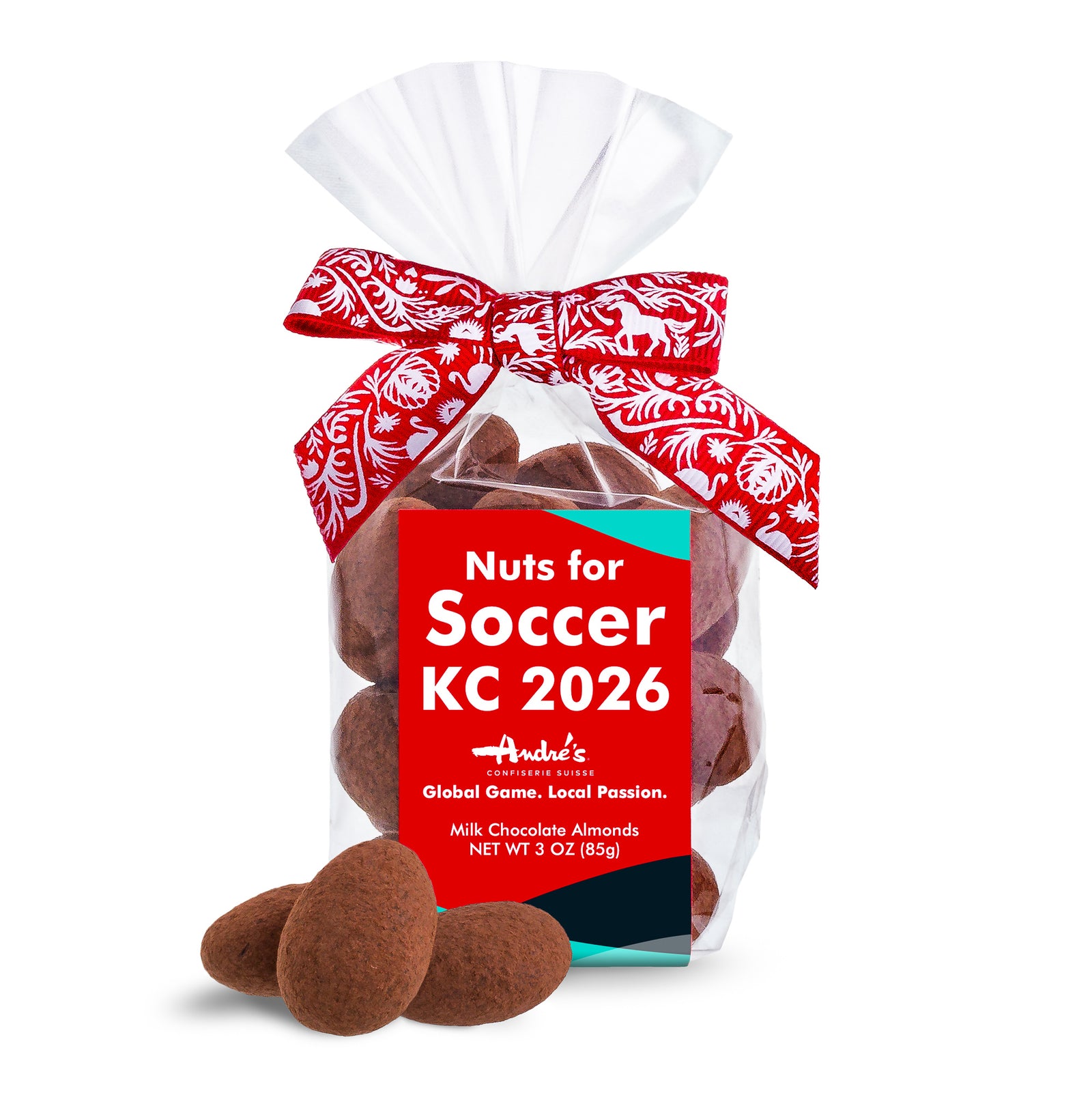 Packaged chocolate almonds with a red label for Soccer KC 2026 event, tied with a decorative ribbon.