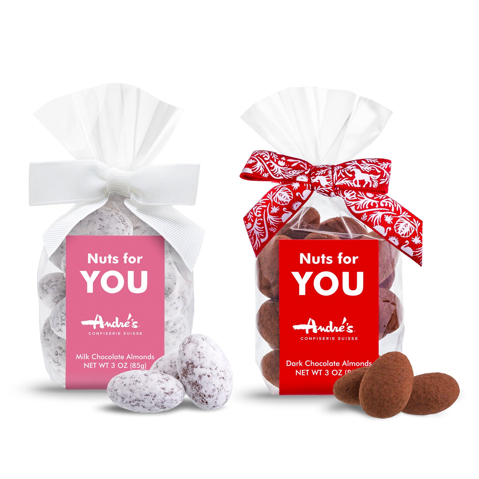 Clear bag of dark chocolate and cocoa powder covered almonds with a red & white Swiss bow and a red "Nuts for YOU" product label with 3 loose almonds beside 