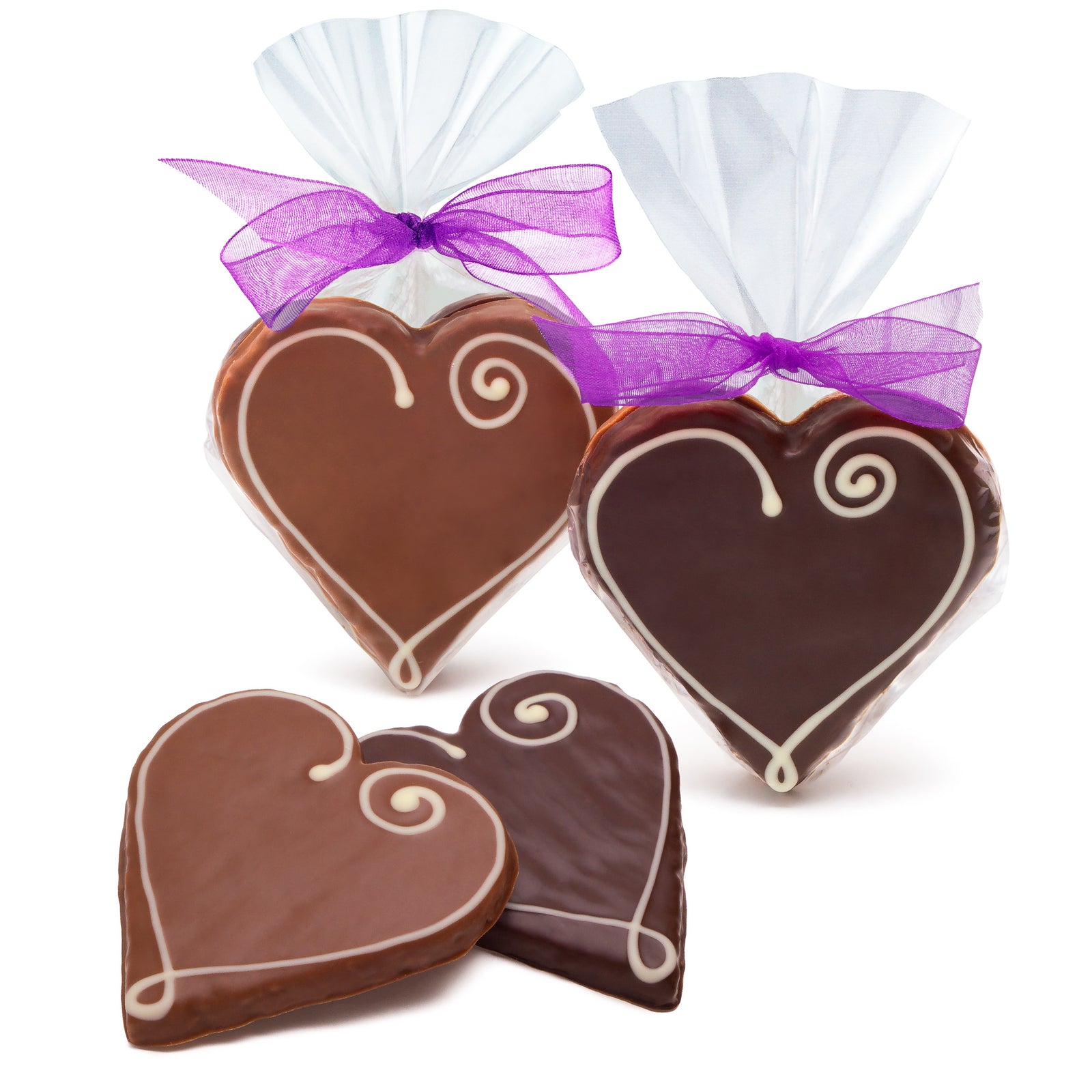 dark chocolate covered heart shaped cookies and milk chocolate heart shaped cookies with white icing heart design. One of each in a clear bag with a purple ribbon, and one of each loose.