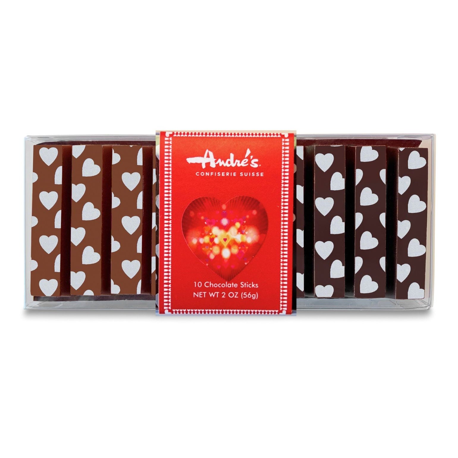 overhead view of clear box filled with milk chocolate sticks on the left side and dark chocolate sticks on the right, all with white heart design printed on them. Red product label features large gold and red heart.