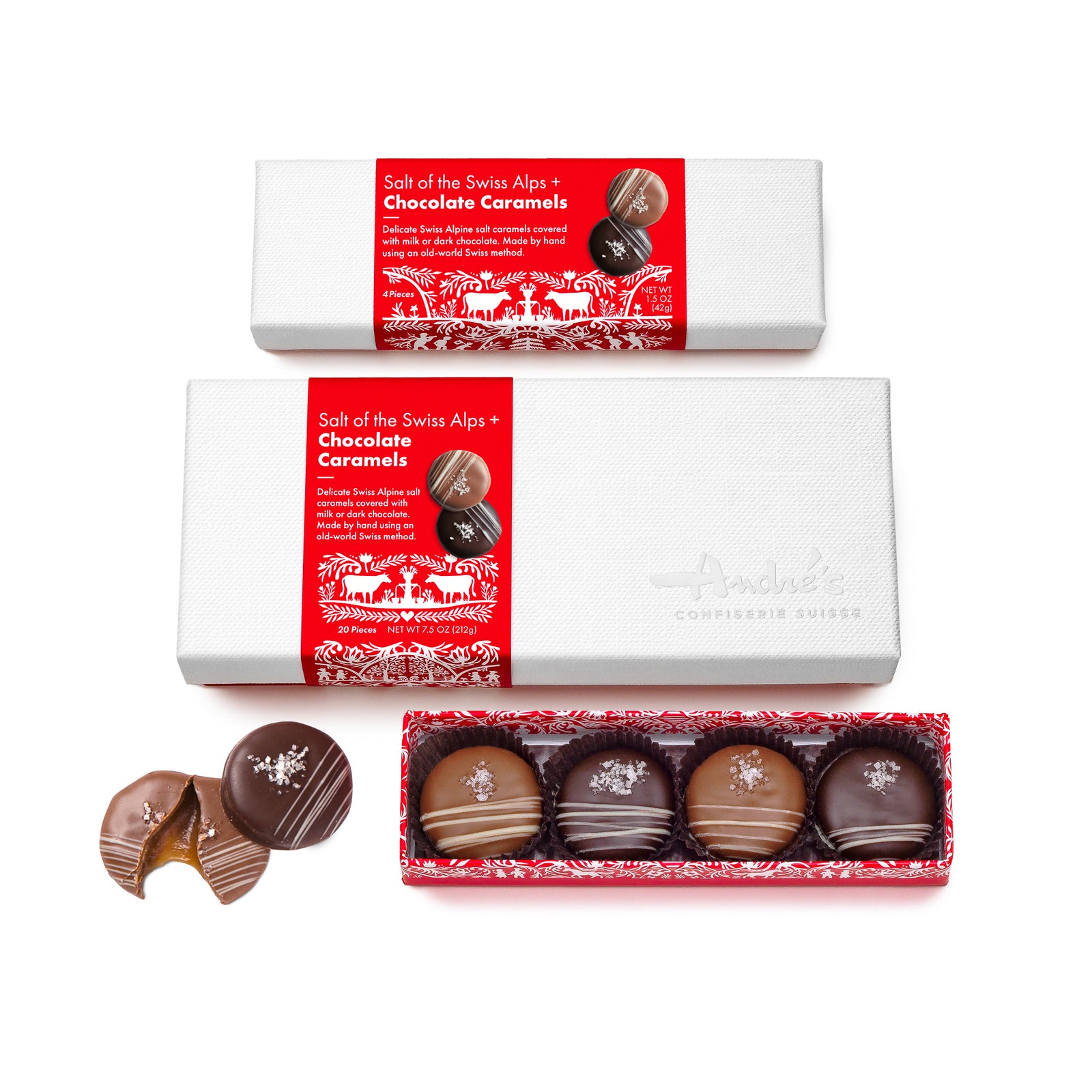 open red box base with 4 caramels visible, alternating milk and dark covered, each with small white chocolate stripe accent and cluster of salt crystals. 2 loose candies beside and 2 closed white lid boxes (one 4 pc, one 20 pc) above with red and white Swiss print packaging.