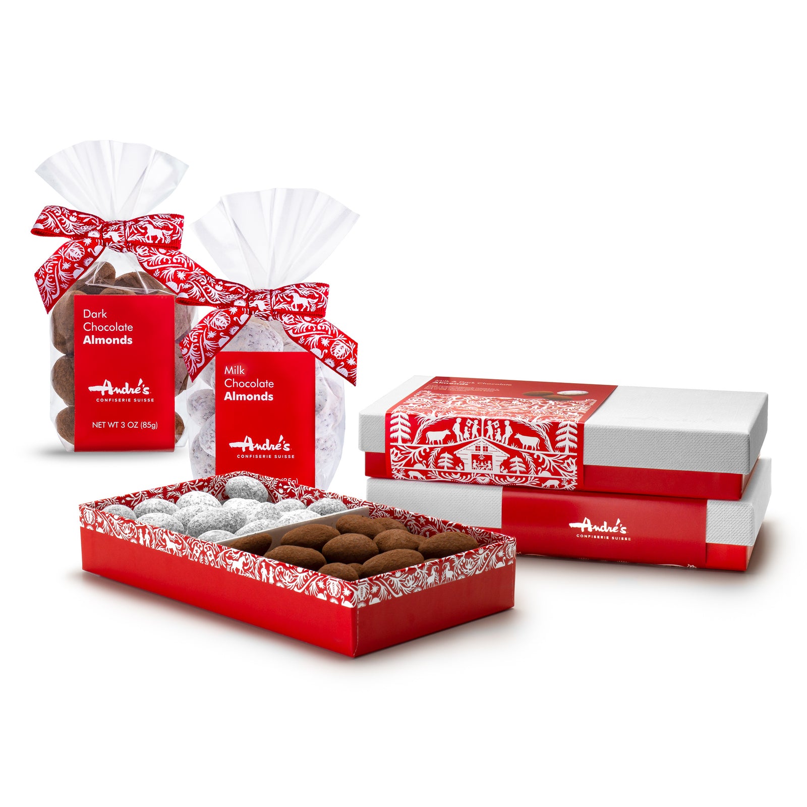 2 bags of chocolate covered almonds with red and white labels and ribbons beside boxes of them that have red bases, white lids and red and white wrappers