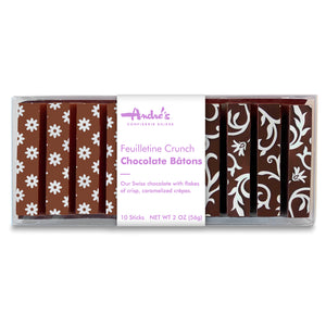 white flower and scrolling vine decor on chocolate sticks