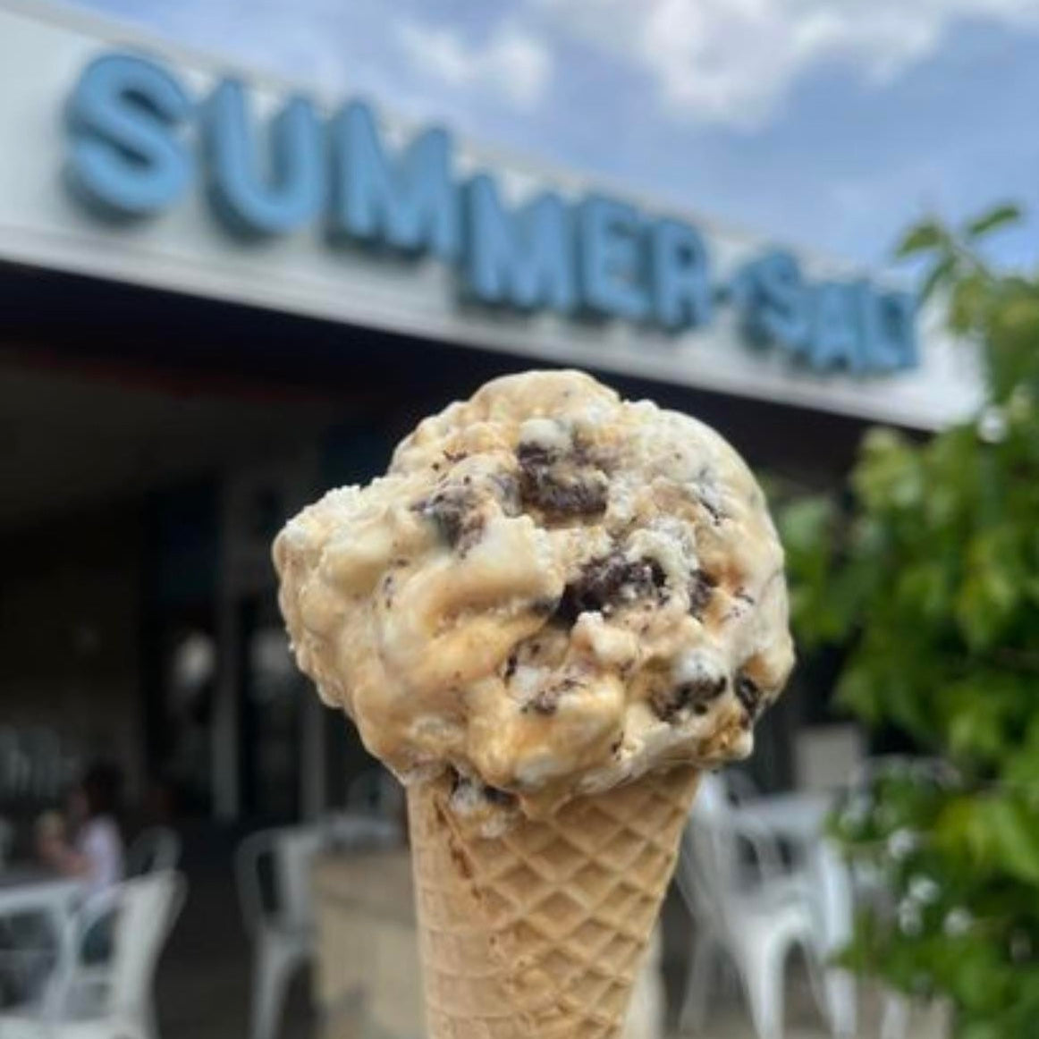 close up of ice cream on a cone in front of the SummerSalt shop