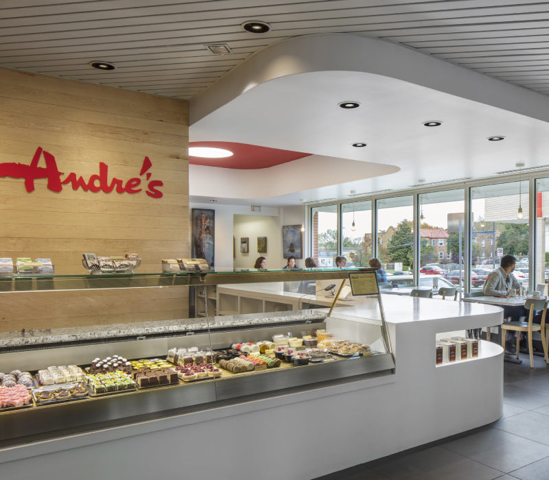 Interior of Andre's shop on Main Street with pastry case and cafe dining area.