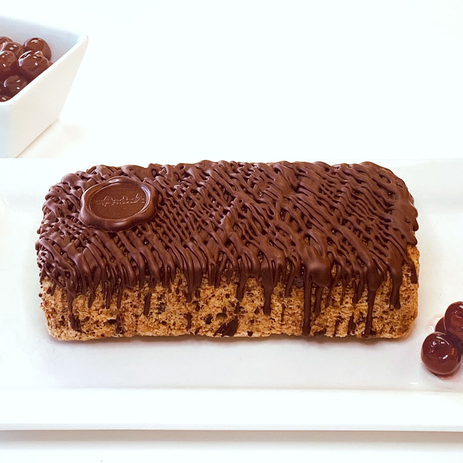 Side angle view of Rose Levy's Swiss Chocolate covered Cherry Almond Pound Cake