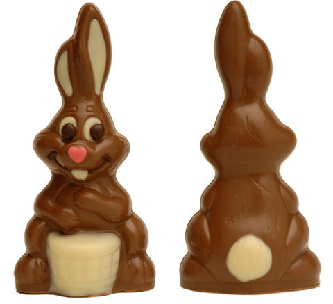 2 milk chocolate bunnies, one facing away with a white chocolate tail, and one facing forward with a pink heart-shaped nose and white chocolate ears, eyes, teeth and bongo drum.