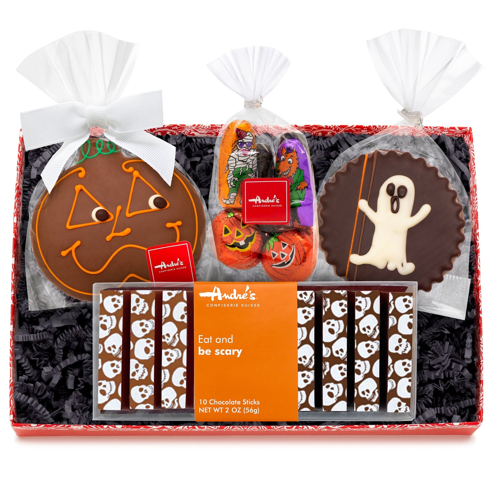 A rectangular box with black springfill and the contents of the Halloween Treat Box.