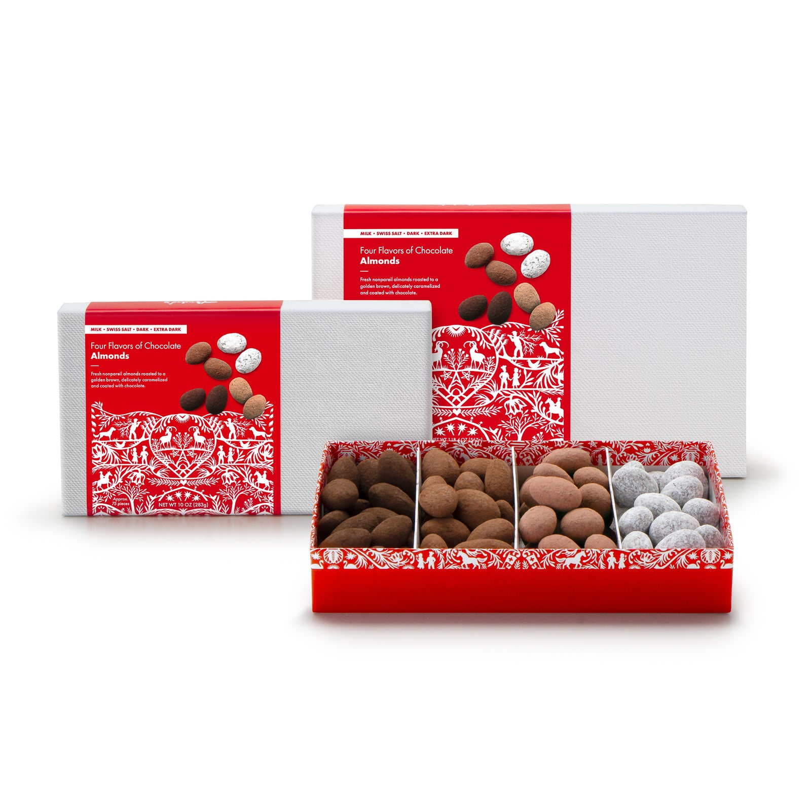 2 white boxes with red Swiss print product labels next to an open box that is divided into 4 sections, each with a different flavor of chocolate covered almonds.
