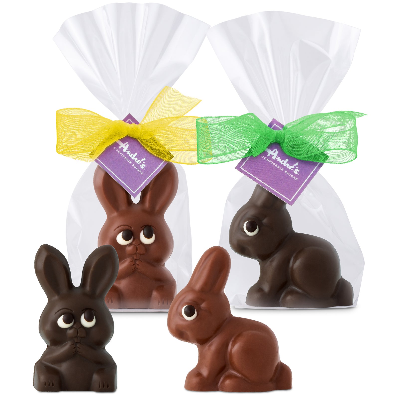 Packaged chocolate bunny rabbits in milk or dark chocolate with yellow and green ribbons.