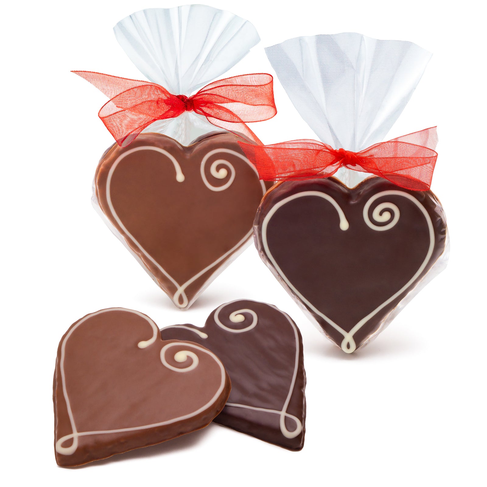 dark chocolate covered heart shaped cookies and milk chocolate heart shaped cookies with white icing heart design. One of each in a clear bag with a red ribbon, and one of each loose.