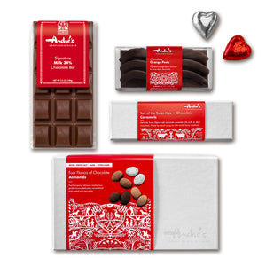 The boxed and labeled items in the gift box laid out on a white table.
