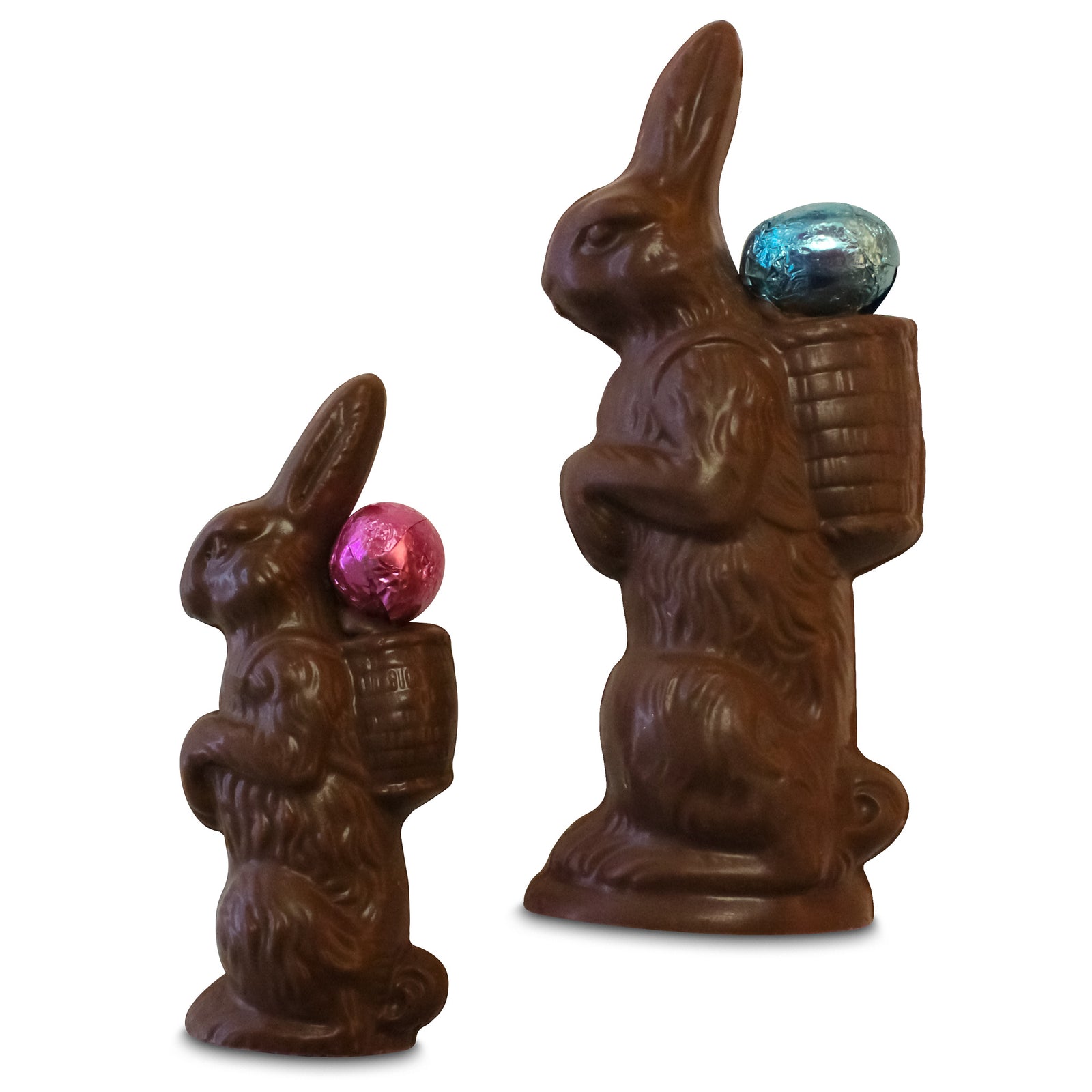 Two chocolate bunnies with eggs; one small on the left without a pink egg, and one larger on the right with a blue  egg.