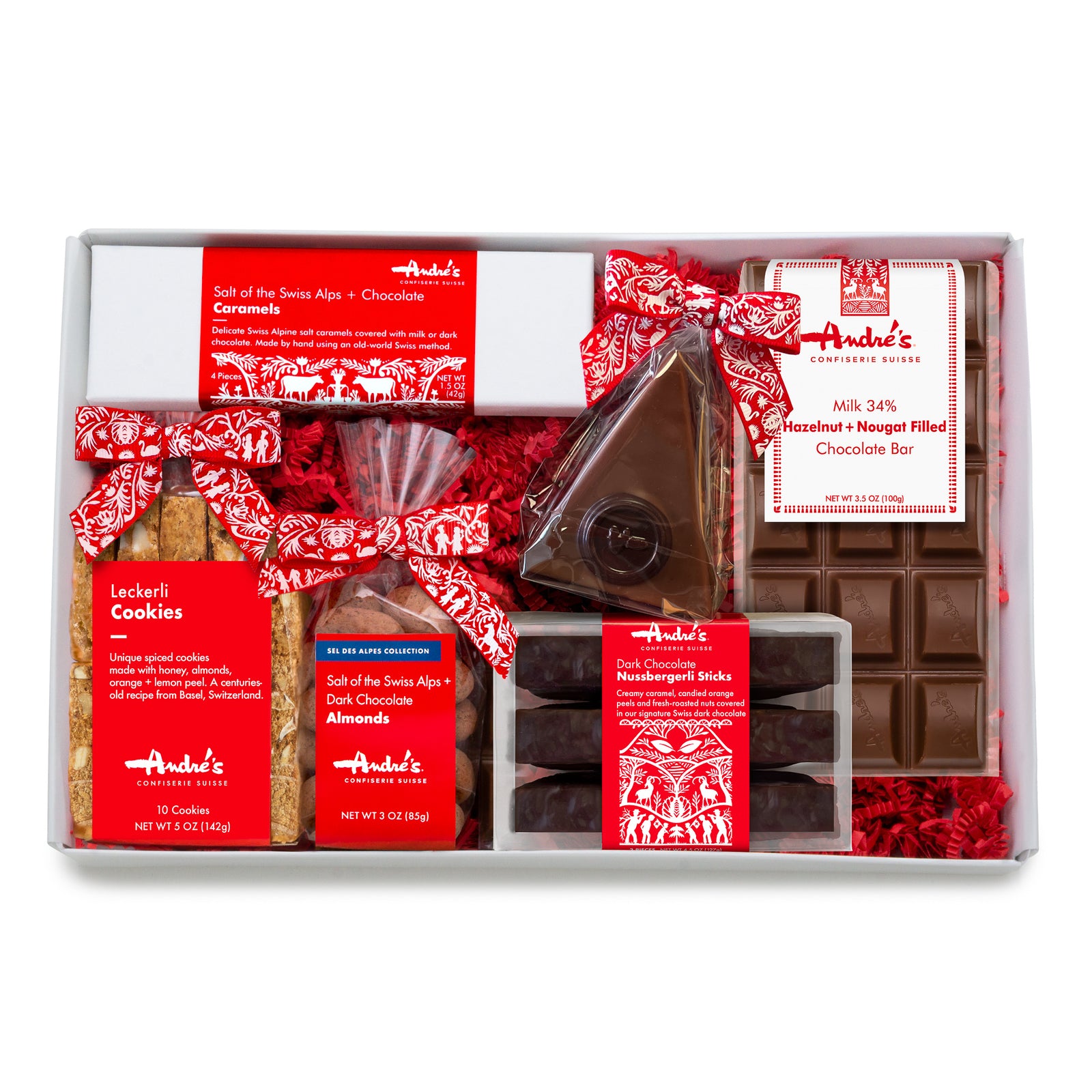 A white box holding the nested contents of the gift box packed with red springfill.