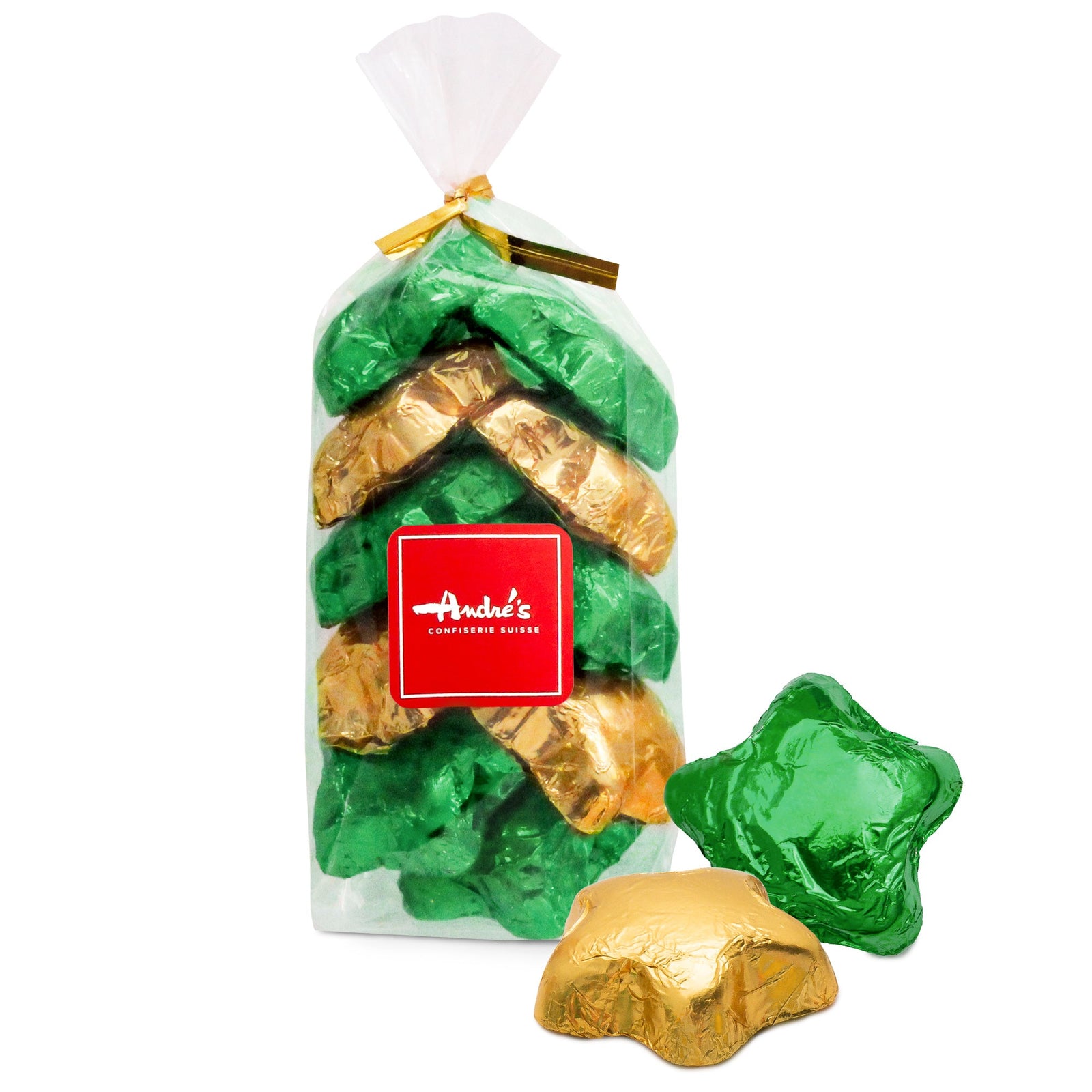 A clear bag filled with 11 white foil-covered disks with green twist tie and red Andre's logo sticker and 2 loose disks beside showing green shamrocks pictured on each disk.