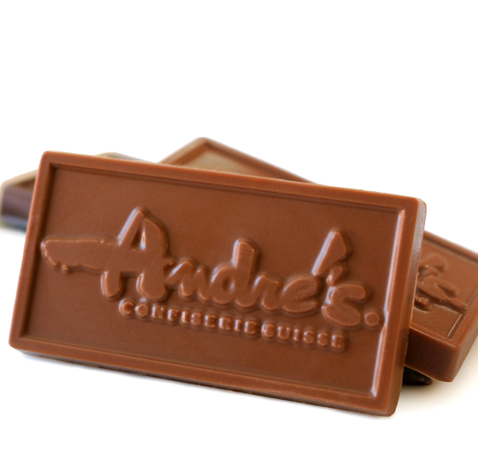 A small rectangular mini bar chocolate with a red and white label indicating it is 34% milk chocolate.