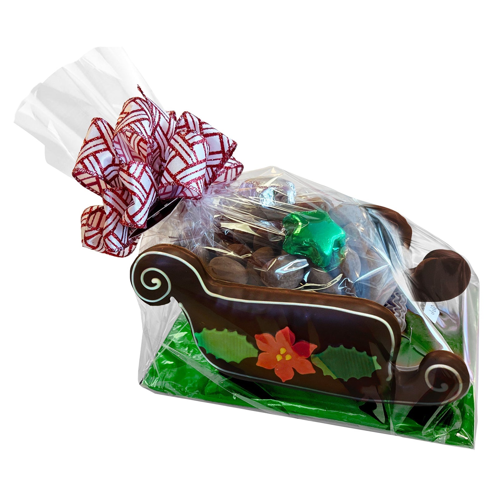 A chocolate candy-filled sleigh, made of dark chocolate gingerbread with poinsettia and holly candy accents, in a clear bag with red, white and silver patterned bow.
