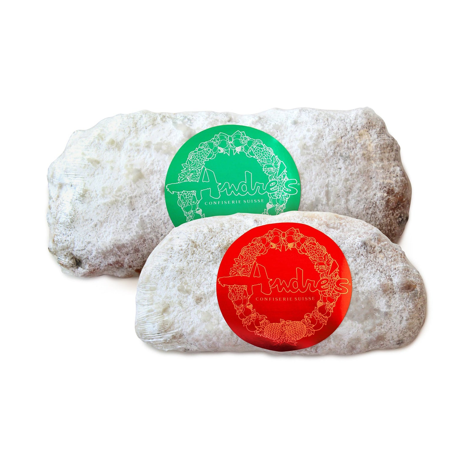 2 recatangular loaves covered in powdered sugar, wrapped in clear plastic with red or green foil Andre's logo stickers in the center of each.